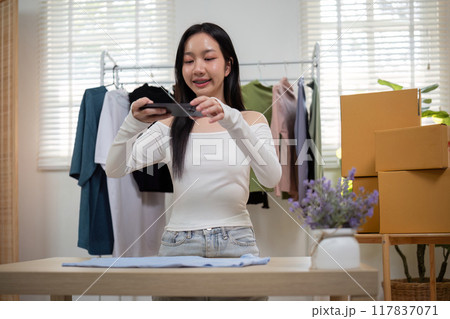 Woman Photographing Clothes for Online Store. Ecommerce Preparation 117837071
