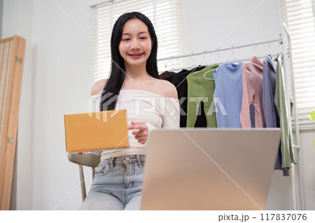 Young Entrepreneur Managing Online Clothing Store Orders. Ecommerce Strategy Young Entrepreneur Managing Online Clothing Store Orders. Ecommerce Strategy 117837076