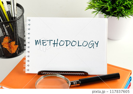 Technology concept. METHODOLOGY written handwritten text in a notebook, notepad Technology concept. METHODOLOGY written handwritten text in a notebook, notepad 117837605