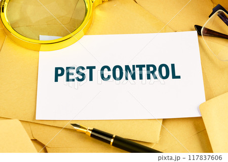 PEST CONTROL written on the card against the background of scattered envelopes 117837606