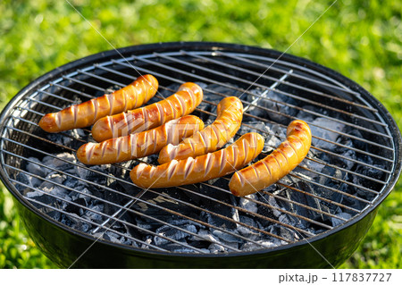 sausages on grill 117837727