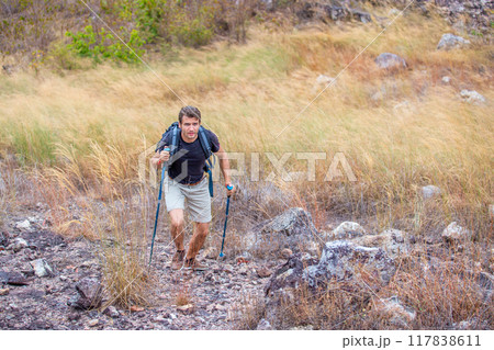Man backpacker walk hiking nature outdoors summer travel adventure outside mountain, lifestyle trekking walking activity. 117838611