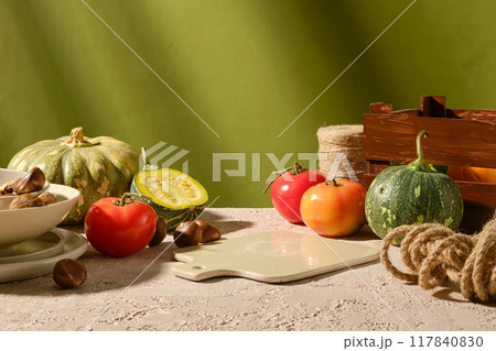 The photo of vegetable in fall season concept, was taken from front view on green background with many sunshine. Blank tray for culinary products displaying in center, copy space The photo of vegetable in fall season concept, was taken from front view on green background with many sunshine. Blank tray for culinary products displaying in center, copy space 117840830