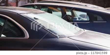 Broken rear window of a black car on the street, close-up Broken rear window of a black car on the street, close-up 117841599