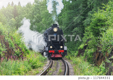 Retro steam train moves between the rocks. Retro steam train moves between the rocks. 117844331