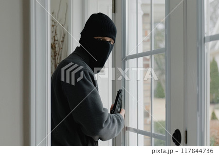 Armed Intruder in Black Mask Entering House 117844736