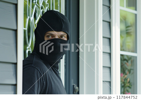 Masked Burglar in a Black Balaclava Masked Burglar in a Black Balaclava 117844752