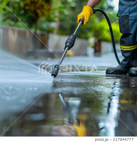 Pressure Washing Pavement with High-Pressure Hose Pressure Washing Pavement with High-Pressure Hose 117844777