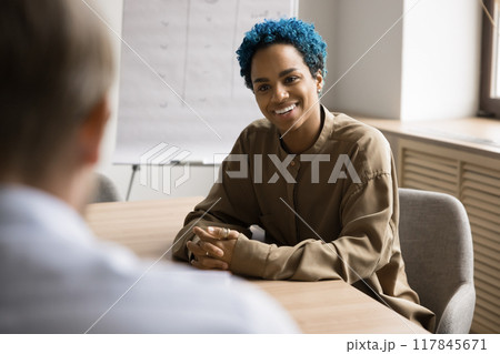Creative profession woman applicant, smiling, answer questions passing job interview Creative profession woman applicant, smiling, answer questions passing job interview 117845671