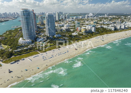View from above of american southern seashore of Miami Beach city. South Beach high luxurious hotels and apartment buildings. Tourist infrastructure in southern Florida, USA View from above of american southern seashore of Miami Beach city. South Beach high luxurious hotels and apartment buildings. Tourist infrastructure in southern Florida, USA 117846240