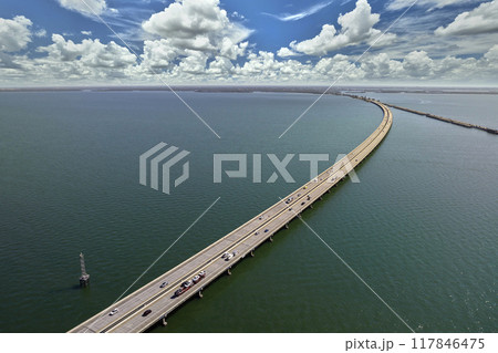 Sunshine Skyway Bridge over Tampa Bay in Florida with moving traffic. Concept of transportation infrastructure 117846475