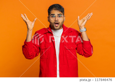 Excited amazed Indian man touching head showing explosion celebrating success, good idea, answer Excited amazed Indian man touching head showing explosion celebrating success, good idea, answer 117846476