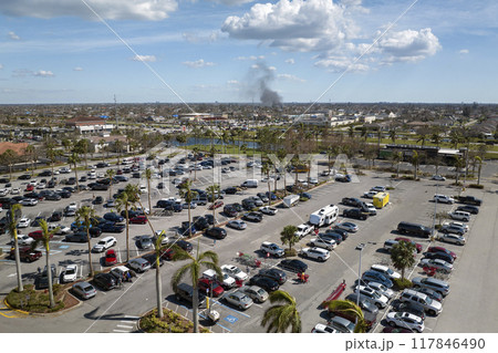 Top view of many cars parked on a parking lot in front of a shopping mall in Florida. Concept of urban transportation 117846490
