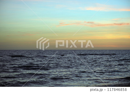 Dramatic red ocean waves at sunset with soft evening sea dark water 117846858
