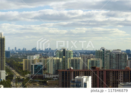 Expensive highrise hotels and condos on Atlantic ocean shore in Sunny Isles Beach city. American tourism infrastructure in southern Florida Expensive highrise hotels and condos on Atlantic ocean shore in Sunny Isles Beach city. American tourism infrastructure in southern Florida 117846879