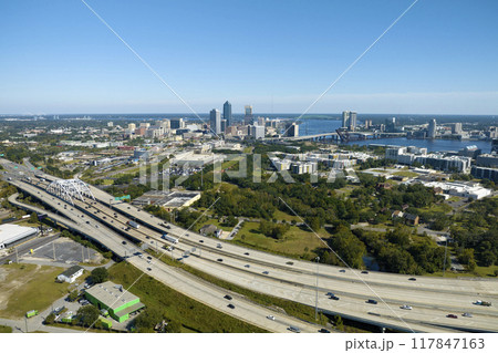 American freeway intersection with fast driving cars and trucks. View from above of USA transportation infrastructure 117847163