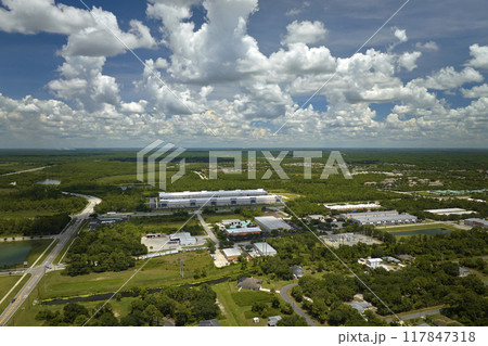 Aerial view of industrial park with goods warehouses and logistics centers in city zone from above 117847318