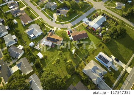 Aerial landscape view of suburban private houses between green palm trees in Florida quiet rural area Aerial landscape view of suburban private houses between green palm trees in Florida quiet rural area 117847385