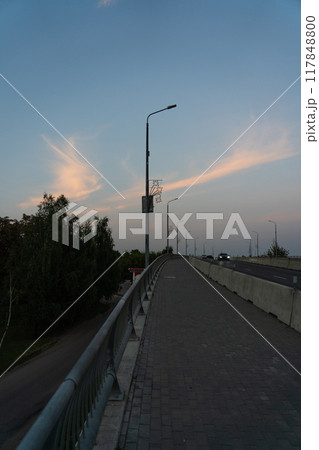 Sunset clear sky on a car bridge Sunset clear sky on a car bridge 117848800