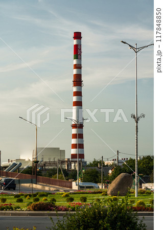 The tall, red and white striped pipe of the factory in the city of Baranovichi 117848850