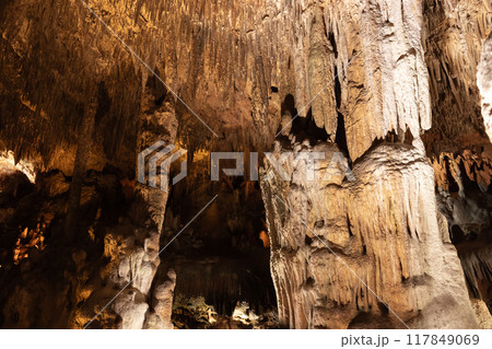 Cave interior with stalactites and stalagmites. Natural photo 117849069