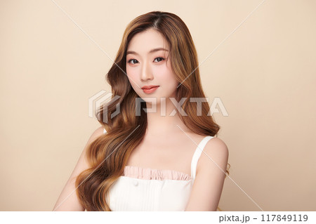 Beautiful young asian woman with clean fresh skin on beige background, Face care, Facial treatment, Cosmetology, beauty and spa, Asian women portrait. 117849119