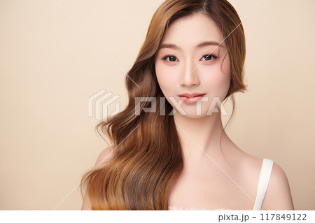 Beautiful young asian woman with clean fresh skin on beige background, Face care, Facial treatment, Cosmetology, beauty and spa, Asian women portrait. 117849122