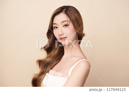 Beautiful young asian woman with clean fresh skin on beige background, Face care, Facial treatment, Cosmetology, beauty and spa, Asian women portrait. 117849123