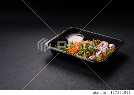 Fresh juicy salad with meat, mozzarella, carrots, lettuce, corn 117851911