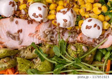 Fresh juicy salad with meat, mozzarella, carrots, lettuce, corn 117851923