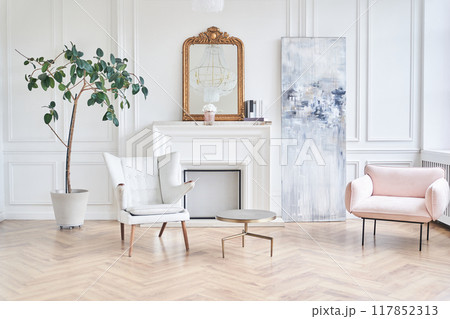 A modern living room with a sofa on a wooden floor, empty walls and a large window. With space to copy. High quality photo 117852313