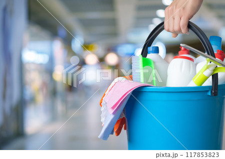 Management holding bucket with cleaning supplies . Management holding bucket with cleaning supplies . 117853823
