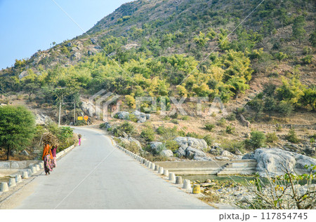 Village road through a rocky terrain 117854745