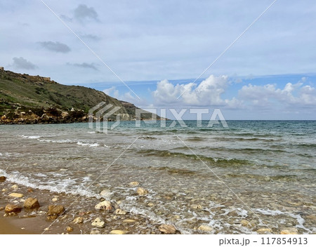 Beautiful sandy beach on the Coast of the island of Gozo, Malta. The Mediterranean Sea. 117854913