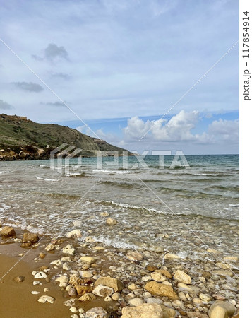 Beautiful sandy beach on the Coast of the island of Gozo, Malta. The Mediterranean Sea. 117854914