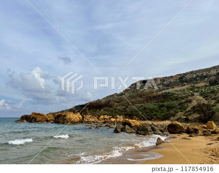 Beautiful sandy beach on the Coast of the island of Gozo, Malta. The Mediterranean Sea. 117854916