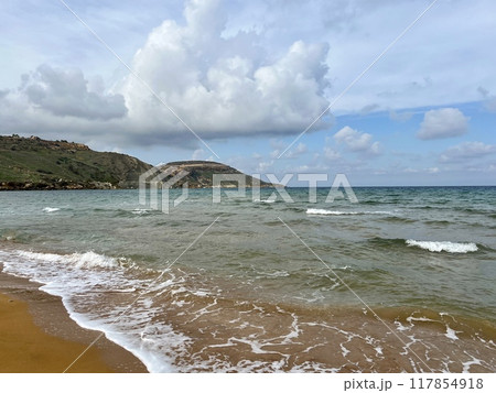 Beautiful sandy beach on the Coast of the island of Gozo, Malta. The Mediterranean Sea. 117854918