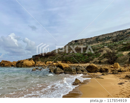Beautiful sandy beach on the Coast of the island of Gozo, Malta. The Mediterranean Sea. 117854919