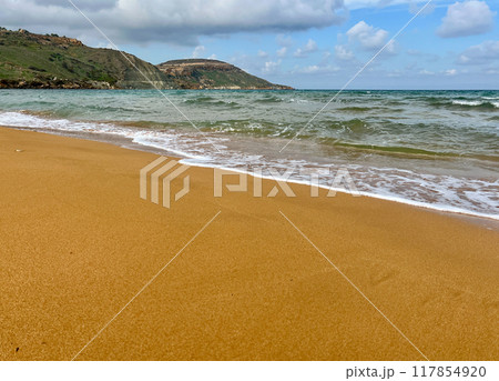 Beautiful sandy beach on the Coast of the island of Gozo, Malta. The Mediterranean Sea. 117854920