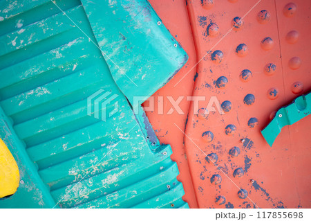 Blue and orange plastic waste background 117855698