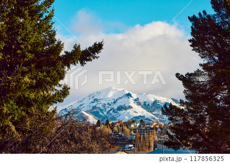 Evening sky over lake, trees and houses 117856325