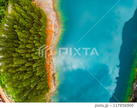 Aerial view of amazing pond in tropical rainforest with mountain rocks peak, Beautiful water surface in Phang Nga Thailand 117856900
