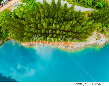 Aerial view of amazing pond in tropical rainforest with mountain rocks peak, Beautiful water surface in Phang Nga Thailand 117856902