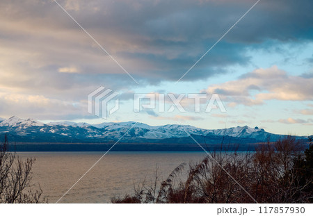 Evening sky over lake and trees Evening sky over lake and trees 117857930