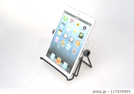 Standing laptop holder set up with ipad on desk 117859905
