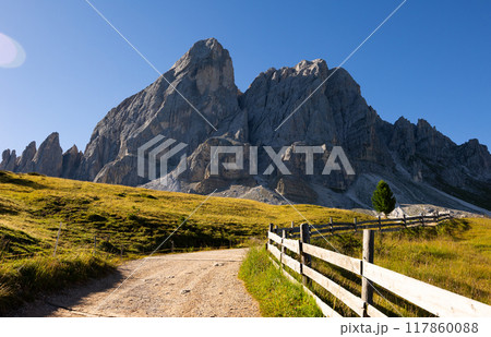 Munt de Fornella, rustic fence and alpine meadow in Dolomites mountains. Beauty of mountains world, South Tyrol, Italy Munt de Fornella, rustic fence and alpine meadow in Dolomites mountains. Beauty of mountains world, South Tyrol, Italy 117860088