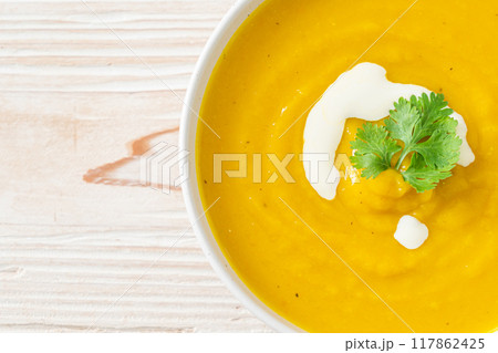 pumpkin soup in white bowl pumpkin soup in white bowl 117862425