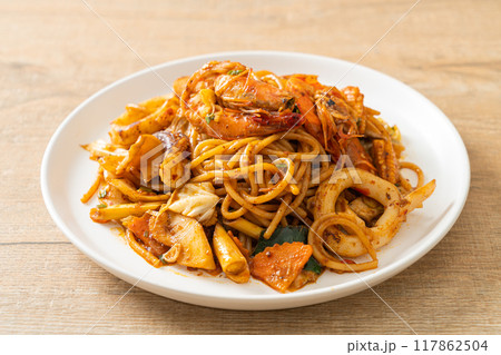 stir fried Tom Yum seafood dried spaghetti 117862504