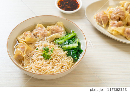 egg noodles with pork wonton soup or pork dumplings soup and vegetable egg noodles with pork wonton soup or pork dumplings soup and vegetable 117862528
