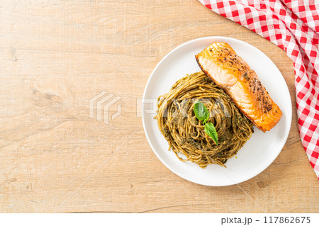 pesto spaghetti pasta with grilled salmon pesto spaghetti pasta with grilled salmon 117862675